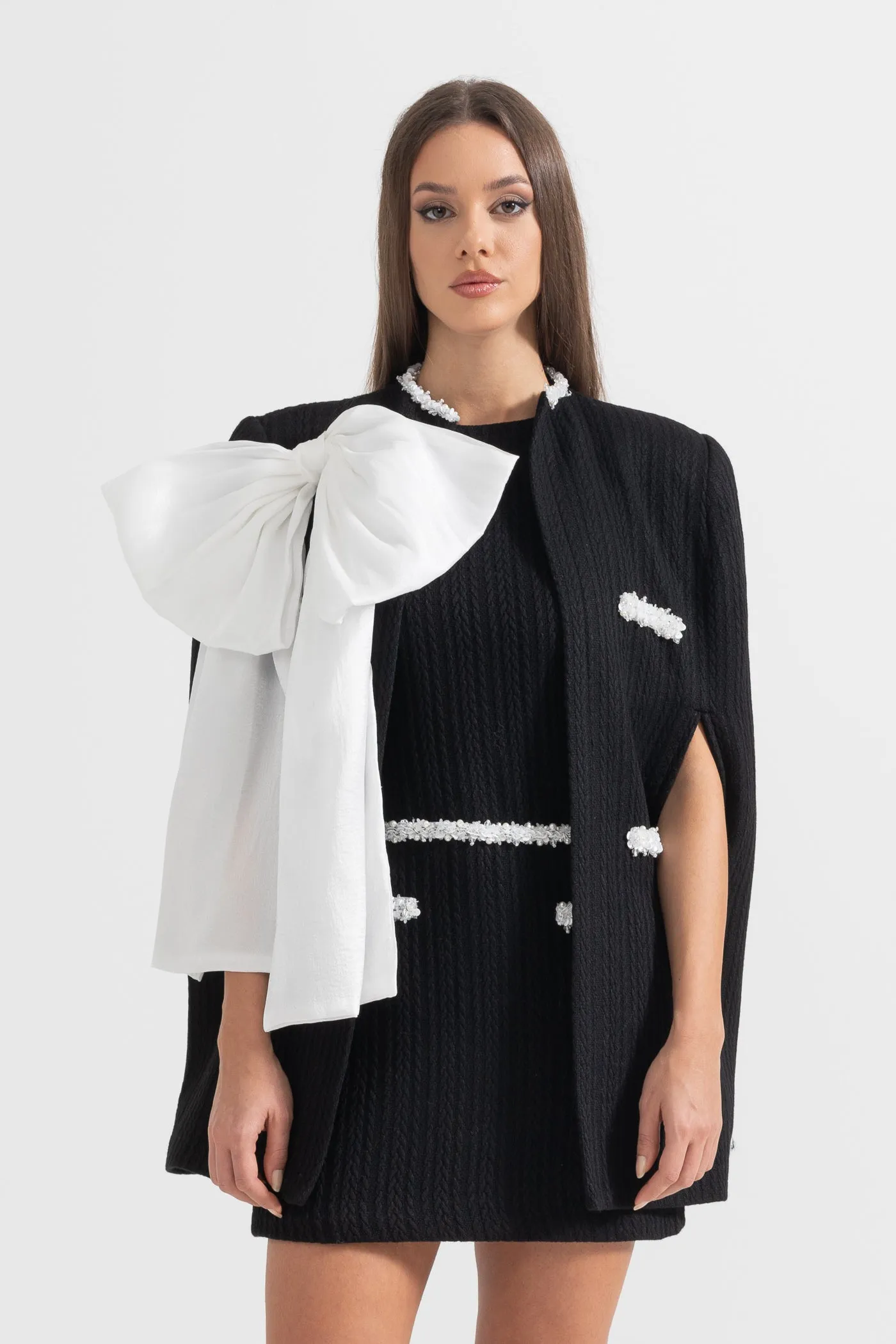 Elegant Textured Overcoat With White Bow Detail - Black